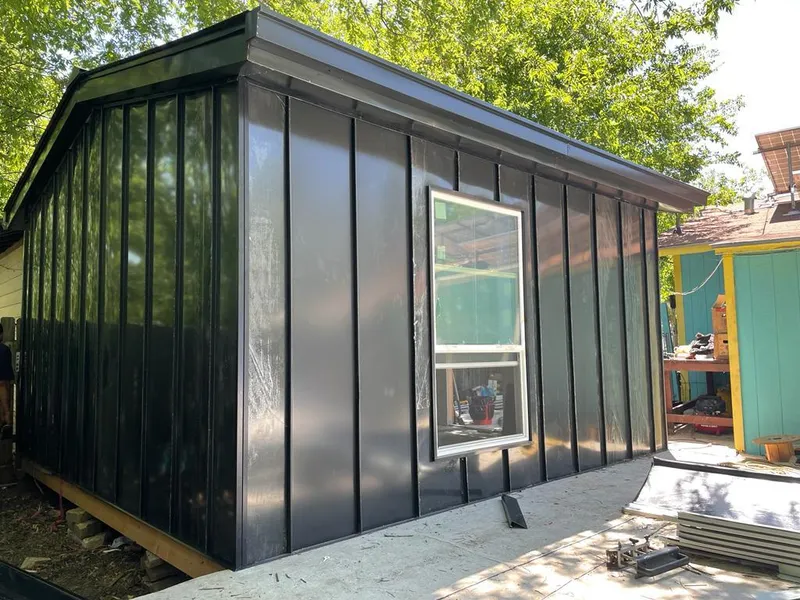 Black standing seam metal wall panels for Roof Inspection in Fraser