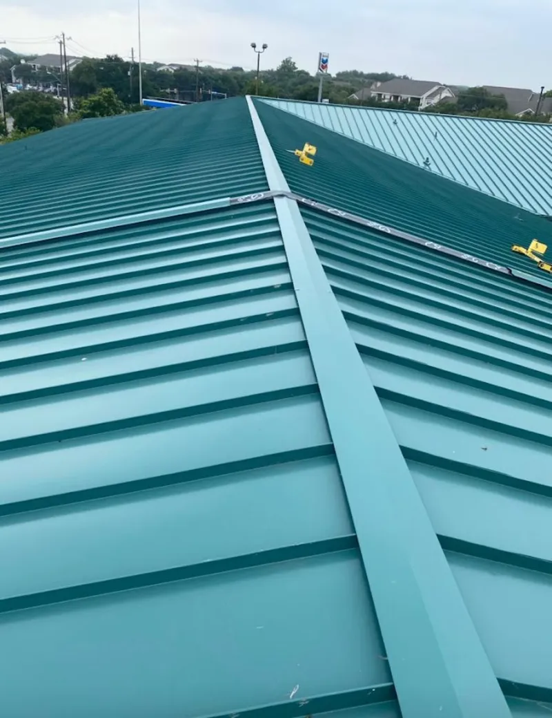 Green commercial metal roof ridge and valley for Metal Roof Repair in Fraser