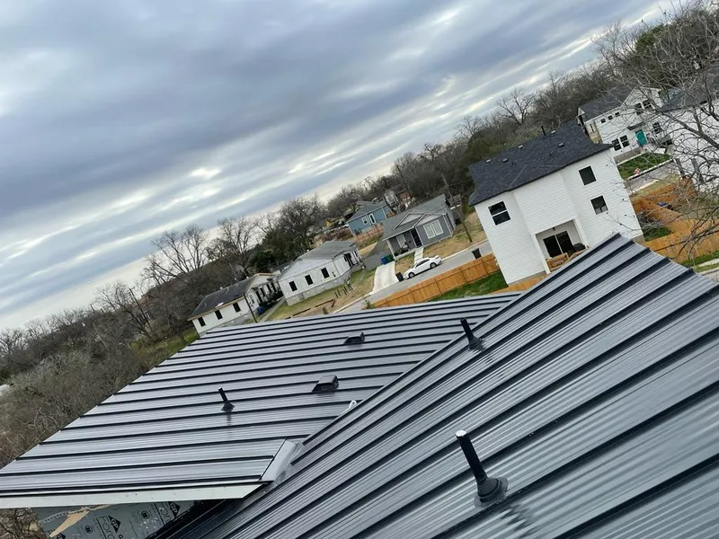 Standing seam metal roof panels with vents for Skylight Repair in Fraser